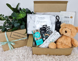Bear Hug baby gift hamper with soft toy and organic newborn items